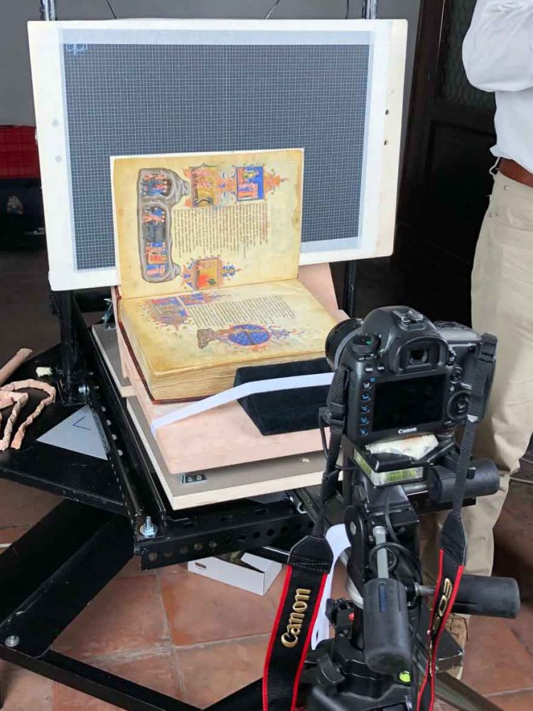 A manuscript being photographed. 