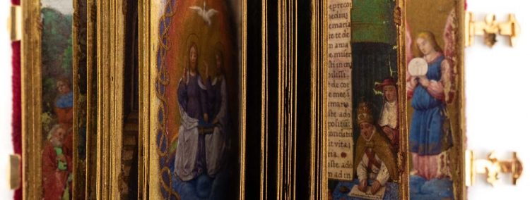 A close up of manuscript facsimile pages in a variety of luxurious colors. 